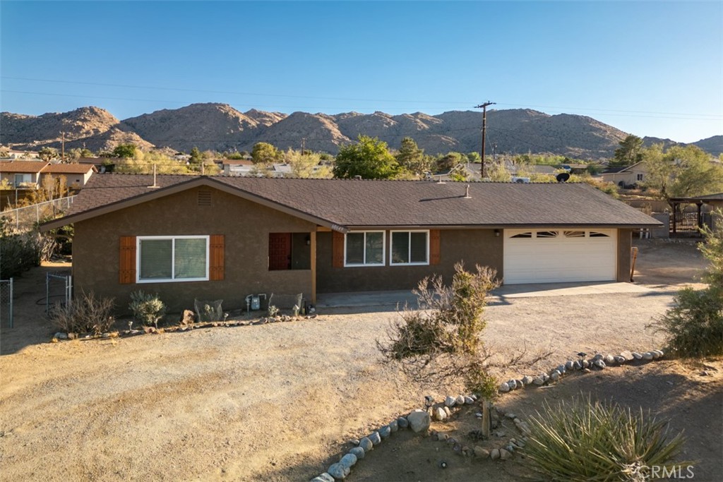 Welcome to your charming desert oasis at 60649 Latham Trail! This beautifully remodeled home is now available for sale and offers 2 spacious bedrooms, 2 stunning bathrooms, and a versatile den with a sliding barn door—perfect for use as a third bedroom, home office, or creative studio.
The open-concept layout is enhanced by a tastefully updated kitchen that brings warmth and character to the living space. Step outside to the enclosed patio, a peaceful retreat featuring a cozy wood stove—ideal for relaxing evenings or quiet mornings.
Situated just minutes from the iconic Joshua Tree National Park, this property offers the best of desert living. A detached shop adds extra potential, whether for a home workshop, art space, or future casita conversion.
Don’t miss the opportunity to own this inviting desert getaway—your perfect retreat awaits!