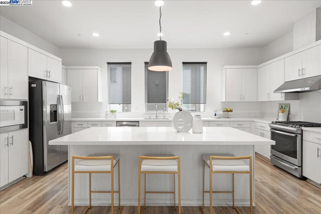 Welcome to 7906 Regional – a beautifully designed townhouse-style condo located in the vibrant heart of downtown Dublin. The condo features 2 bedrooms, 2.5 bathrooms and boasts a bright and airy open-concept living space with soaring 10-foot ceilings with an abundance of natural light. The sleek, contemporary kitchen is equipped with quartz countertops, white cabinetry, stainless steel appliances, and a spacious center island, ideal for cooking and gathering. Step outside to your private rooftop deck, an outdoor retreat perfect for relaxing. This home includes an attached two-car, side- by-side garage. The condo is within walkable distance to BART and moments from top shopping, dining, and everyday conveniences. This home delivers comfort, style, and unbeatable urban access!