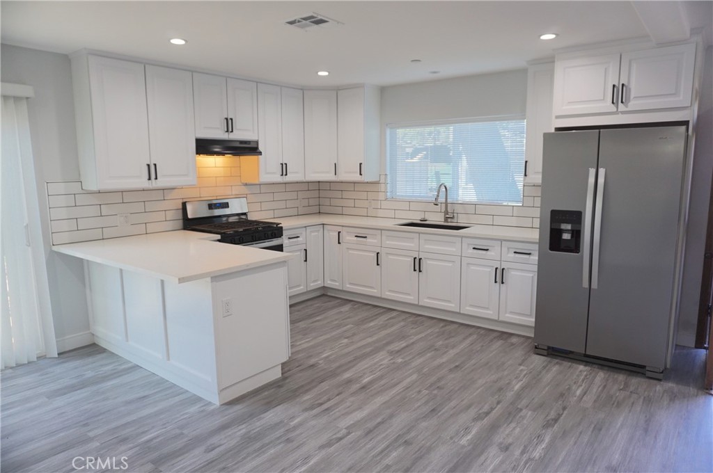Spectacular 2 story ADU in Chatsworth! (BACK HOUSE) 3 Beds + 2 full baths 1,200 SF of living space Built in 2023. Enter through the front door into the light and bright living room, newer recessed lights and dual pane windows. Gourmet kitchen has white cabinets, quartz countertops and stainless-steel stove, dishwasher, microwave, fridge, washer & dryer included. 1 bathroom and full bathroom on the 1st floor for convenience. Newer laminate floors throughout. Upstairs two spacious bedrooms with new floors, ceiling fans, recessed lights and shared a full custom bathroom with double sink and frameless shower doors. Beautiful overlooking balcony. Central AC/Heater. Parking on the street. Good size front yard with private patio, pavers, storage shed and new vinyl fence. Sorry no pets. The location is remarkable – Easy 118 Freeway access, movies, grocery, coffee, Metrolink, restaurants and close to Westfield Topanga mall & The Village. Come view, fall in love, and make this beautiful property yours!