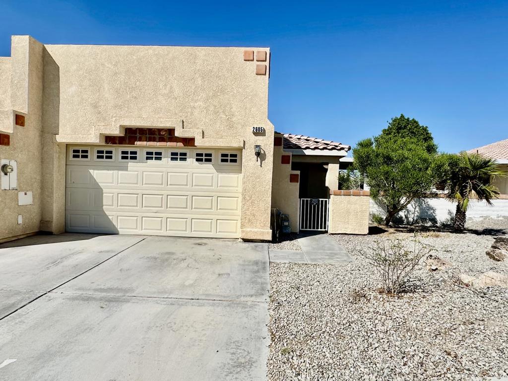 Golf Course Living - 2 Bedroom, 2 Bath HomeEnjoy golf course views every day from this charming 2-bedroom, 2-bathroom home with an inviting open layout. The spacious living area flows seamlessly into the dining space and kitchen, creating the perfect setting for both relaxing and entertaining. The kitchen offers ample cabinet storage, stainless steel appliances, and a convenient breakfast bar.The primary suite features a private bath and walk-in closet, while the guest bedroom and second full bath provide comfort and flexibility for family or visitors. Step outside to the extended covered patio and take in the peaceful setting overlooking the fairway--ideal for morning coffee or evening gatherings.Additional highlights include vaulted ceilings, tile flooring, ceiling fans throughout, an attached single car garage, and easy-care desert landscaping. Located in a desirable golf course community, this home combines comfort, convenience, and lifestyle.