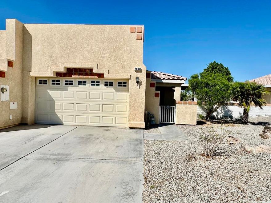 Golf Course Living - 2 Bedroom, 2 Bath HomeEnjoy golf course views every day from this charming 2-bedroom, 2-bathroom home with an inviting open layout. The spacious living area flows seamlessly into the dining space and kitchen, creating the perfect setting for both relaxing and entertaining. The kitchen offers ample cabinet storage, stainless steel appliances, and a convenient breakfast bar.The primary suite features a private bath and walk-in closet, while the guest bedroom and second full bath provide comfort and flexibility for family or visitors. Step outside to the extended covered patio and take in the peaceful setting overlooking the fairway--ideal for morning coffee or evening gatherings.Additional highlights include vaulted ceilings, tile flooring, ceiling fans throughout, an attached single car garage, and easy-care desert landscaping. Located in a desirable golf course community, this home combines comfort, convenience, and lifestyle.