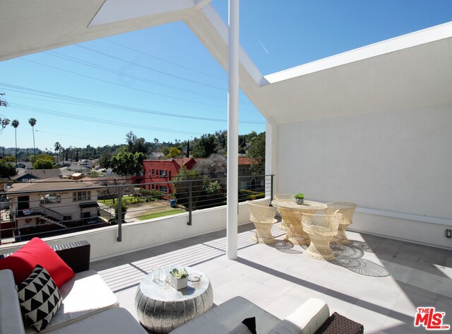 Last home for sale at Heyday's newest development in Eagle Rock. Living at Everlee is a statement about sustainability, design, and livability for the future of LA. Walk to Sprouts, restaurants, shops, and more. These 7 homes are constructed by an AIA award winning local firm, Heyday Partnership. Their 13+ years of experience is evident at every turn with unprecedented attention to detail, craftsmanship, and design. This energy efficient LEED Certified home features 2 bedrooms + 2.5 bathrooms, apx. 1930 sq ft.,3 story, attached 2 car garage with direct entry, gated driveway,and low maintenance exterior. Stunning master suite with 14' vaulted ceiling, luxurious bathroom + walk in closet. Large walk-out tiled balcony with 180 degree view and is perfect for entertaining. Open floor plan with oak flooring throughout, smart phone thermostat, high-end fixtures, Fleetwood windows, and custom built-ins.Custom kitchen island, spacious dining room & living area.