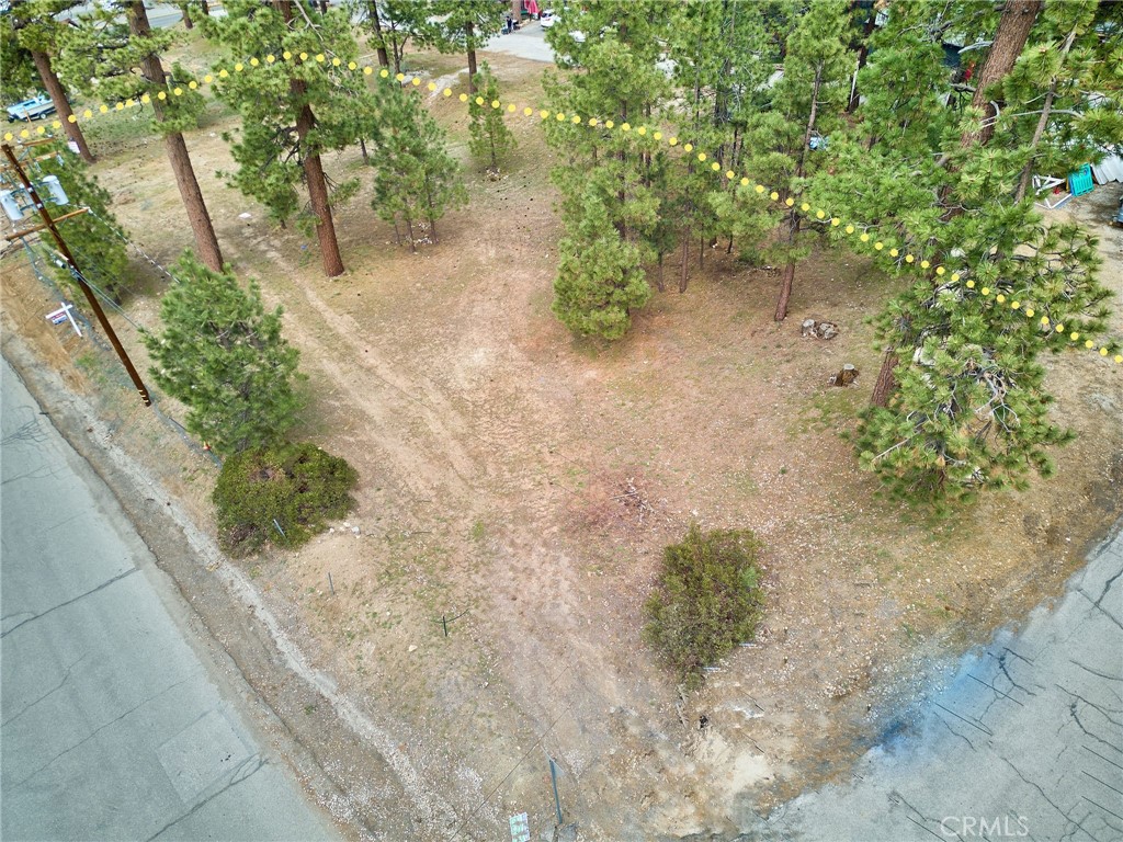 Zoned C-2 this lot is located in a prime location just off Big Bear Blvd. Excellent visibility due to high volume of vehicle and pedestrian traffic. Walking distance to Snow Summit, Big Bear Lake, and the Village. A site plan for a 16-unit lodge/hotel, with 20 parking spaces, and 3 EV charging stations has been approved by the city of Big Bear Lake. Lot merger has been completed. Relatively flat parcel located across the street from McDonald's and NAPA Auto.