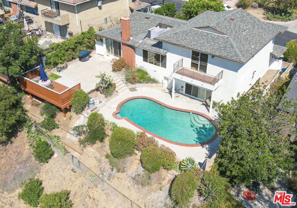 A Rare Hilltop Oasis with Breathtaking Views - Tucked away on a serene hillside just above Eagle Rock, 4540 Wawona Street offers a rare combination in Los Angeles living panoramic views with near-total peace and quiet. Though just moments from the York Blvd exit off the 2 Freeway, there is virtually no freeway noise here only stillness, sunrise skies, and birdsong. This is true hilltop tranquility. This 3-bedroom, 3-bathroom home features approx. 1,979 sq ft of light-filled living space on a 15,000 sq ft hillside lot (approx. 0.35 acres). Enjoy sweeping, unobstructed views of Downtown LA, the San Gabriel Mountains, and rolling hills a cinematic backdrop that transforms daily life. The interior welcomes you with a bright, open-concept layout connecting the living, dining, and kitchen areas. Large windows frame stunning sunrises and bring natural light into every corner. All three bedrooms are private and well-sized, with the primary suite offering hillside views and an en-suite bath.Step outside and you'll find one of the home's crown jewels a sparkling pool set against breathtaking views. Above it, a spacious deck creates the perfect setting for morning coffee or evening relaxation your own mountaintop caf.Beyond the pool, the tiered backyard offers additional space for gardening, outdoor dining, or simply enjoying the calm of nature. Despite its secluded feel, the location provides easy access to Downtown LA, Dodger Stadium, LA Ktown, Pasadena, and the shops and restaurants of York Blvd. A functional floor plan, and great natural light throughout. Homes like this offering iconic views, quiet surroundings, a pool, and unbeatable convenience rarely come to market. Don't miss your chance to own this private hilltop escape in one of Northeast LA's most desirable neighborhoods.