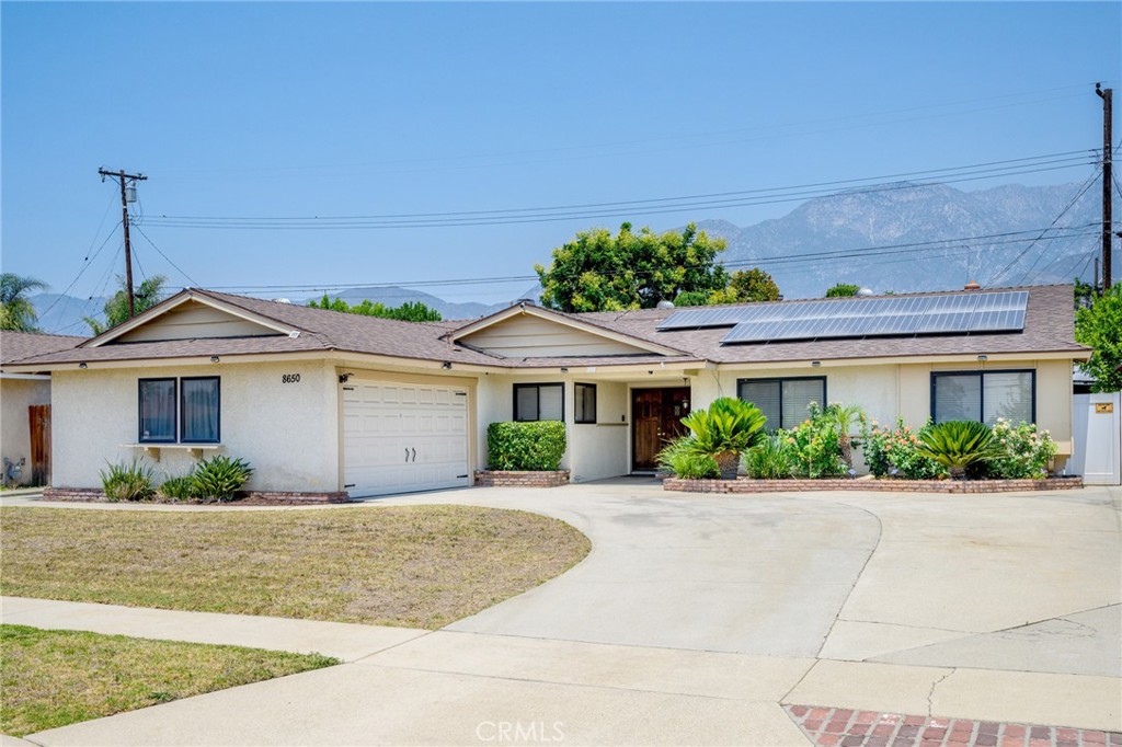 Amazing single-story home located in the wonderful Alta Loma area of Rancho Cucamonga! Located just South of 19th St. and just West of Carnelian St., this home is a gem! Super-clean, crisp, and spacious with fantastic updates. 5 bedrooms, 2 full baths. 2,150 sqft inside, sitting on a spacious 7,245 sqft lot. Entry leads to spacious living-room with gas fireplace and custom hearth. Updated kitchen features granite counters, recessed lighting, and stainless appliances that come with the house. Dinning area sits adjacent to kitchen and features a pony wall that connects into the living-room. Primary bedroom is the largest of the five bedrooms and features a recently remodeled bath with large shower. Second and third bedrooms are near the Primary and large guest bath with shower and tub. Fourth and fifth bedrooms are on the other side of the house, just beyond the kitchen. All bedrooms feature ceiling fans. Fifth bedroom does not have closets but could serve as a great office space. One side of the backyard features a fantastic workshop with a barn door entry, laminate flooring, and lights. The other side of the backyard features a matching Gazebo to entertain. Laundry area sits in roomy 2+ car garage with workspace and lots of cabinets. Washer and dryer come with the property. Roof is in excellent condition with solar energy. Large driveway with room for several cars including an RV! A tastefully appointed and spacious Alta Loma gem on a lovely manicured lot. This home oozes pride-of-ownership and is ready to welcome a new owner. It won’t last long!