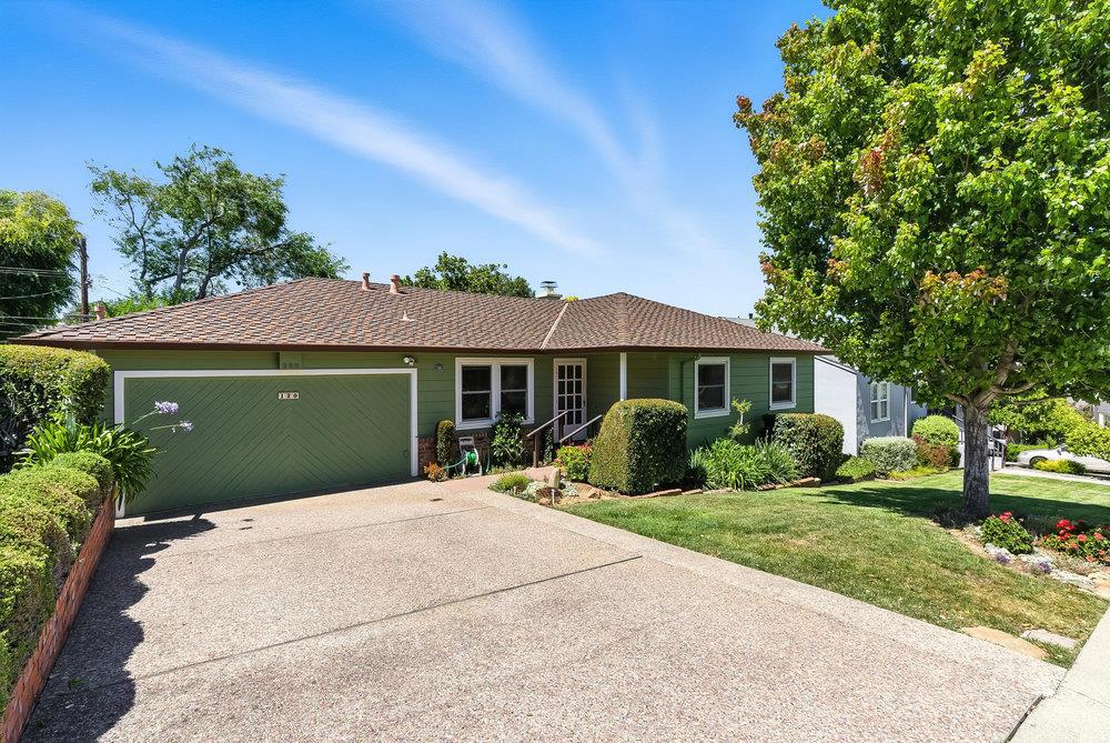 This charming 3-bedroom, 2-bathroom single-level home, offers a perfect blend of comfort, style, and convenience. From the moment you arrive, you'll appreciate the beautifully landscaped front yard, mature trees, and inviting curb appeal. Inside, the bright and airy living room features hardwood floors, recessed lighting, and a stone fireplacecreating a warm and welcoming atmosphere. The thoughtfully designed layout flows into a light-filled kitchen with ample cabinetry, a gas range, and a cozy breakfast nook overlooking the front garden. Each of the three bedrooms offers comfortable living space, while both bathrooms are well-appointed and functional. The garage has been converted into a spacious family room, providing flexible space for lounging, work, or play. Step outside to the private backyard oasis, where you'll find lush landscaping and plenty of room to relax or entertain. This home is move-in ready and full of potential.