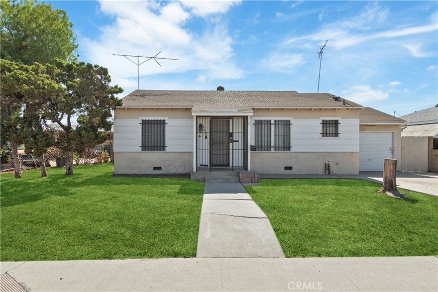 Potential-Packed 2 Bed / 1 Bath Corner Lot with R.V. Garage. Don't miss this centrally located home, situated on a spacious corner lot with tons of character. Perfect for first-time home buyers, downsizers and investors alike. This property offers practicality and convenience. With easy access to the 5 and 170 freeways, you'll find comfort in having shopping, schools and parks close by. The layout features a living area, a practical kitchen and two comfortable bedrooms. The front garage may have potential to become an added bedroom or Junior ADU. Pull in from the alley access by a wide swing gate that opens into a spacious backyard. A rare find, this property also includes a RV Garage with high clearance, ideal for RVs, boats or extra storage. The inside of the garage boasts plenty of cabinet space and a workshop, complete with a vintage solid wood workbench. The yard also includes two shed for added storage. Bring your vision and make this home your own!