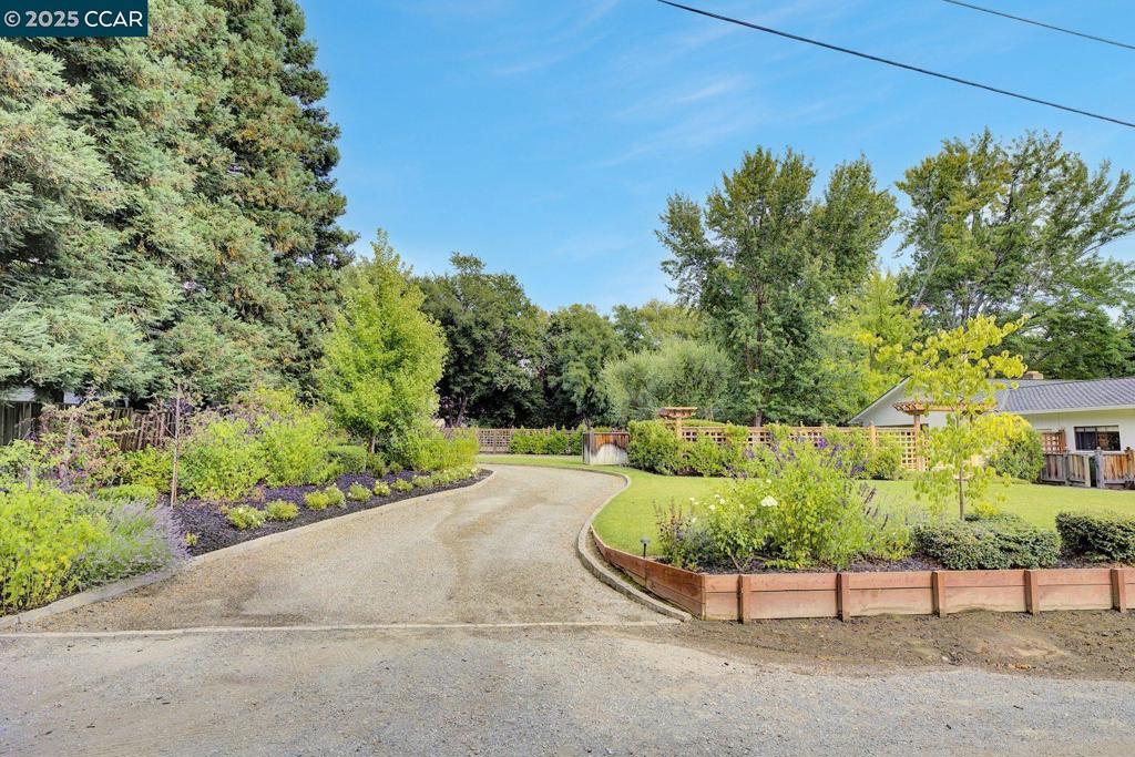 Premium Opportunity! Whether you're a buyer with a vision or a builder seeking your next standout project, this proposed lot represents an amazing, rare chance to create something exceptional in a sought-after East Bay location. Build your dream home on this flat proposed lot! Located on a serene private lane in one of Danville’s most coveted enclaves, this rare approximately half-acre FLAT lot (NOT yet split) offers an exceptional opportunity to build a custom dream home or a luxurious spec residence. Surrounded by multi-million dollar estates and located between Blackhawk Country Club and Diablo Country Club, the setting is both prestigious and peaceful. Preliminary steps have been taken to subdivide this parcel, and this offering reflects the newly envisioned half-acre(+/-) portion of the lot, providing ample space for an expansive residence and stunning outdoor living features. Buyer(s) to verify ALL details, feasibility, sqft/acreage, and possibilities. The lot line/sqft is NOT final/no separate APN yet. The resulting lot sqft and acres may vary based on lot finalization.