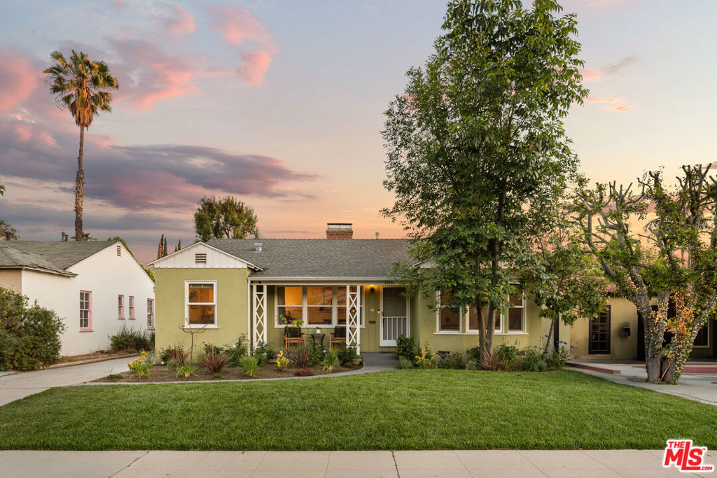 Style, form and function unite in this exceptionally redesigned and reimagined 1940s California Traditional sited in the acclaimed Colfax Charter School District and the most sought after neighborhood in Valley Village: An idyllic, vibrant, tree lined community and wonderful place to call home! Updated with the design and amenities ideally suited for today's contemporary lifestyle, the home features an appealing open floor plan that provides gracious transition from room to room, suffused in an abundance of natural light from expansive windows. With a spacious front porch and a lush front fusion of floral and greenery, the home offers wonderful curb appeal and bids a warm welcome. Wood floors grace the living areas. Recessed lighting glows throughout the home. Remodeled baths feature fine lighting, fixtures and finishes. The open kitchen is optimally designed for the adventurous at home chef and features fine stainless steel appliances and breakfast bar. Adjoining the dining room, it's the perfect gathering place for friends and family. Glass sliding doors bring the outdoors in and give way to a backyard lawn, patio and swimmer's pool perfect for endless al fresco leisure and limitless outdoor entertaining. Highlights include updated electrical and HVAC, tankless water heater, window replacement throughout and fabulous, near 600 Sq.Ft. FULLY PERMITTED DETACHED ADU BUILT IN 2020 offering a myriad of possibilities! Centrally located just moments from beloved Valley Village Park with proximity to NBC, CBS, Disney, Warner Bros. and Universal Studios, and the art galleries, studios, eateries, and theaters of the famed NoHo Arts District. Welcome! *NOTE: Main house: 2 + 2 w/approx 1,381 sq.ft. ADU: 1 + 1 w/approx. 591 sq.ft.*