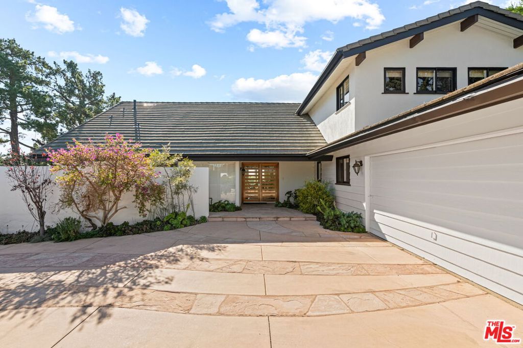 Designer-Perfect Contemporary with Panoramic Ocean & Canyon Views. Experience the ultimate California lifestyle in this warm contemporary retreat, where sweeping ocean and canyon vistas set the stage for unforgettable living. Situated on a private lot with a sparkling pool, this residence seamlessly blends dramatic architecture with luxurious modern updates. A striking two-story entry welcomes you into an open, light-filled floor plan featuring pitched beam ceilings, a step-down living room with fireplace, and maple hardwood floors throughout. The chef's dream kitchen is anchored by a custom center island and fitted with top-of-the-line appliances including a Viking range, double Gaggenau ovens, SubZero refrigerator, dual Miele dishwashers, Dacor warming drawer, and water filtration system perfect for everyday living and effortless entertaining. Four spacious bedrooms and four baths provide comfort and privacy, with a phenomenal primary suite offering a cozy fireplace, private terrace with jetliner views, dual walk-in closets, and a spa-like bath reminiscent of the Four Seasons. Additional highlights include a family room with wet bar and wine fridge, a bonus area off the garage, and custom sliders that open to an entertainer's paradise complete with outdoor fireplace, built-in BBQ, pool with fountain, and professional landscaping. Available furnished or unfurnished, this exceptional property offers both sophistication and ease, in a setting that captures the very best of Southern California living.