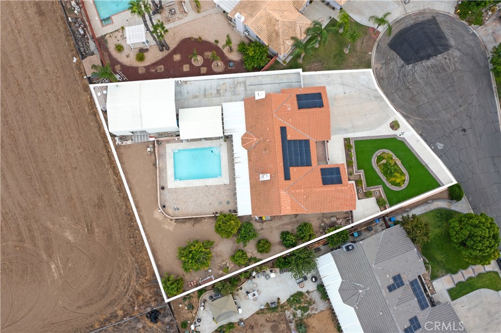 Located in the Heart of Nuevo, this Single Story Home is Perfectly Positioned on a Cul de Sac Among Pride of Ownership Properties.....The Entrance is Inviting with Porch and Double Doors into Formal Living Room Opening Up to Dining Room with Views of Manicured and Tastefully Landscaped Front Lawn...Kitchen has Views of Spacious Back Yard, and Leads to Family Room with Fireplace, Adjacent to Oversized Laundry Room with Sink and Cabinets, and Half Bathroom.... The Primary Bedroom has Double Door Entry Including Built In Cabinets and Fireplace, the Balance of Bedrooms are Spacious and One of Them has Office Possibilities....The Back Yard is a Private Oasis Offering Massive Covered Patio, Pool, "Mini Orchard" and More than Enough room for Motor Homes, Trailers, Toys.... Solar and Front Area for Additional Patio Area Compliment this Property......