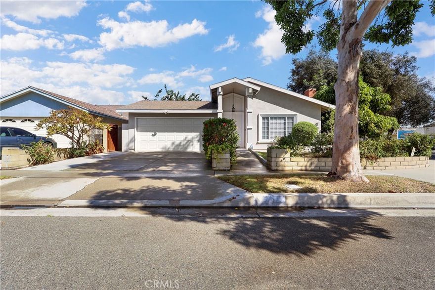 Welcome to 12947 Arabella Place - A beautifully updated single-story home tucked away on a quiet cul-de-sac in one of Cerritos' most desirable neighborhoods. This charming 3-bedroom, 2-bathroom residence offers an inviting blend of comfort, functionality, and tasteful upgrades across approximately 1,789 square feet of living space. Step inside to discover an open and airy floor plan featuring soaring cathedral ceilings, a stunning flagstone fireplace, and abundant natural light throughout. The remodeled kitchen is a chef’s delight with granite countertops, custom cabinetry, and seamless flow into a cozy family room with recessed lighting and ceiling fans. A formal dining area opens through sliding glass doors to a private backyard deck, perfect for indoor-outdoor entertaining. The spacious primary suite boasts a thoughtfully enlarged ensuite bathroom with granite finishes and ample storage. Additional highlights include wood flooring in bedrooms, newer textured ceilings, central HVAC, and an attached two-car garage with direct home access and laundry hookups. Situated on a 5,597 sq ft lot, the landscaped backyard features a covered patio, built-in seating, and mature fruit trees—offering a serene outdoor retreat. Located within the top-rated ABC Unified School District and just minutes from parks, Cerritos Town Center, and the public library, this home combines tranquil suburban living with urban convenience.