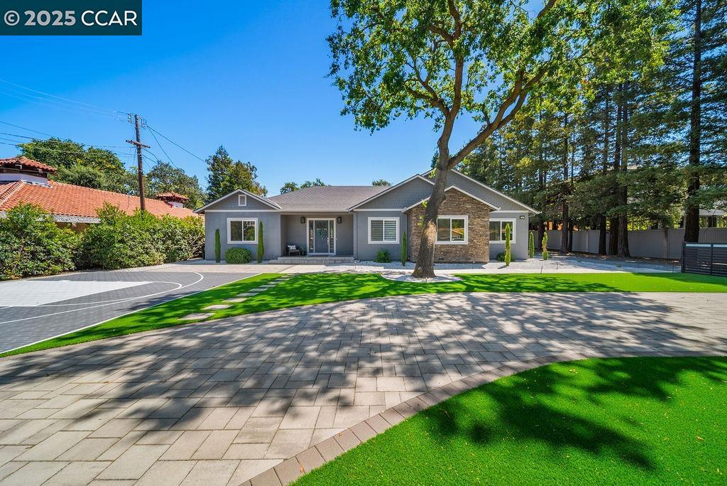 Welcome to 100 Alderwood Road, an extraordinary single-level residence crafted by the renowned Morisey Group. Built in 2018, this custom-designed home offers 3,250 square feet of refined living space on a perfectly flat half-acre lot in one of Walnut Creek’s most desirable neighborhoods. From the moment you step inside, the grand great room with soaring ceilings creates a stunning focal point, blending natural light and open space to provide the ideal setting for both everyday living and stylish entertaining. The home features five spacious bedrooms and three elegant bathrooms, thoughtfully designed to balance comfort and functionality. Designer finishes, high-quality craftsmanship, and carefully considered architectural details are showcased throughout, offering a seamless blend of luxury and practicality. Every element of this residence has been curated to deliver timeless sophistication with modern convenience. Situated within the highly sought-after Walnut Creek School District, this home not only provides an elevated lifestyle but also places you near top-rated schools, parks, shopping, and the vibrant downtown.