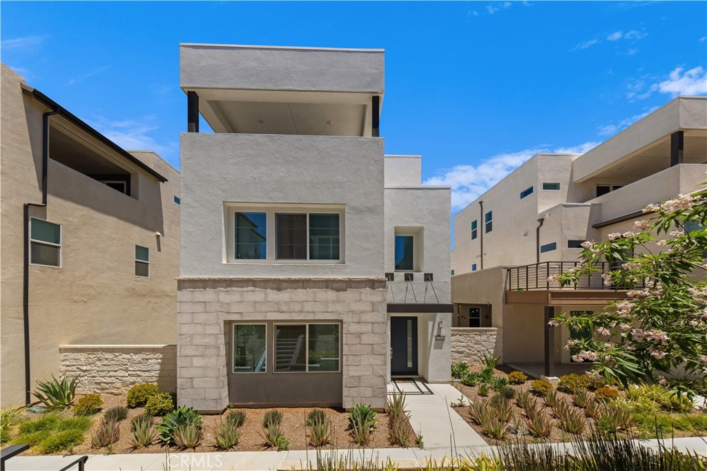 GREAT LOCATION, modern home in one of Valencia’s newest neighborhoods! This spacious, three-story home was built in 2022 and features 4 bedrooms, 4 1/2 baths, with a large 3rd floor loft! The first floor features upgraded flooring, recessed lighting, and an open-concept kitchen that any home chef will love—complete with a large island, stainless steel range hood, gas stove, built-in oven, oversized refrigerator, and a generous walk-in pantry. There’s even a first-floor bedroom —ideal for guests or extended family. The backyard is perfect for lounging and entertaining as well.
Upstairs, you’ll find a relaxing primary suite with a spa-like bathroom, featuring a large walk-in shower, soaking tub, and dual vanities. There’s also a built-in office nook that makes working from home easy and efficient. The third floor is a real bonus: a huge loft space that can be used as a game room, home theater, gym, or even a fifth bedroom. There's also a balcony up here—great for enjoying morning coffee or evening sunsets.
Energy-efficient solar panels help keep utility costs down. The location is unbeatable—within walking distance to parks, close to great schools, and just minutes from the 5 Freeway and Six Flags Magic Mountain. Whether you’re commuting, raising a family, or just looking for a fun and functional place to call home, this home checks all the boxes. Don’t miss the chance to see this beautiful Valencia home for yourself!