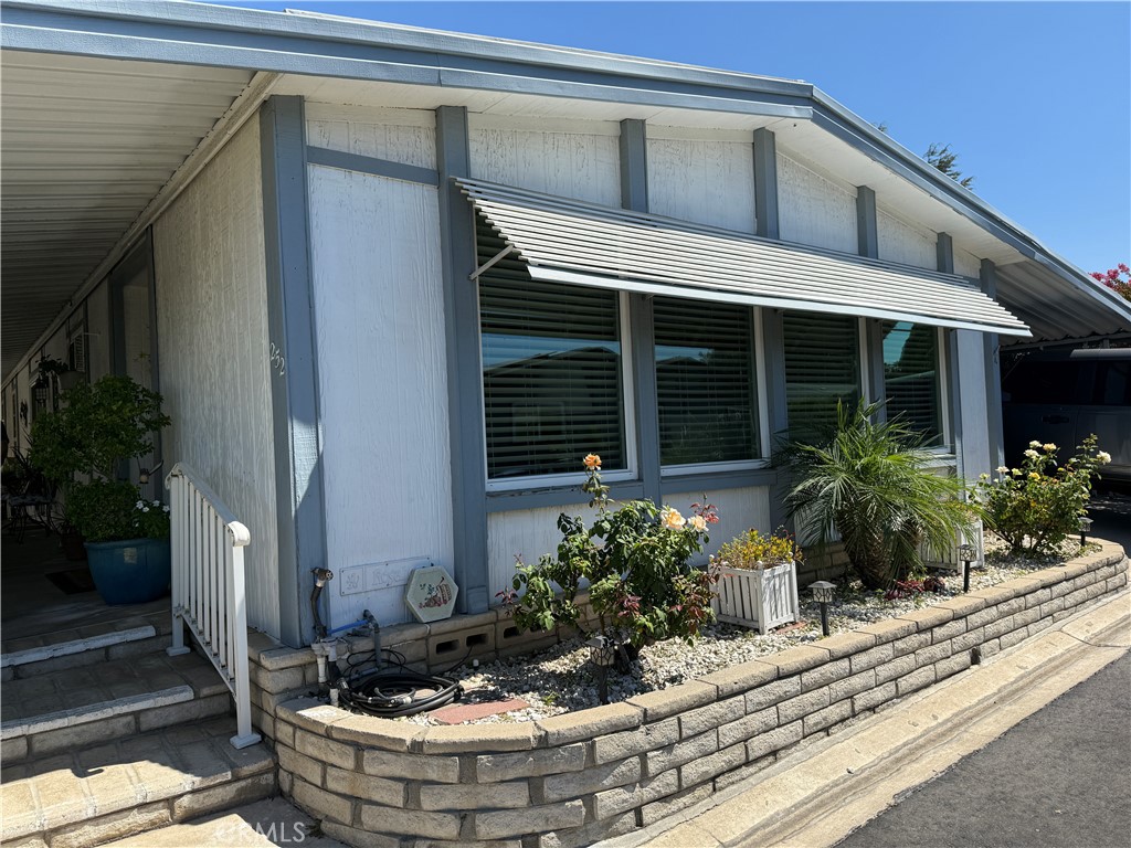Nice Senior 55 and over residential gated community. Both mobile homes and modular homes in this lovely deveoplement with a stream running through.
This mobile home is in immpecable conditon with carport full debth of home and on west side covered patio. This community has many ammendtied, such as in ground swimming pool, spas, library, gym, putting green, walking trails, koi pond, billiards room and more. Not getting bored here!
Laundry room has desk area and tons of storage, Master bedroom has full bath with soaking tub and seperate shower and built in storage for linens.
New windows, formal living room with dining room and a seperate family area off of kitchen and sit at bar for meals.
Storage shed at end of carport, still allows ample space for two vehicles.