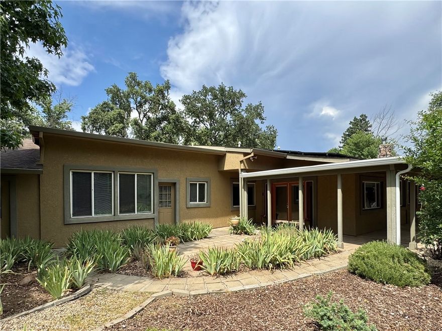 Secluded 5-Bedroom Home on Cul-de-Sac Lot in Central Chico

Tucked at the end of a quiet cul-de-sac, this spacious 5 bed, 3 bath home offers 3,212 sq ft of living space on over half an acre (28,314 sq ft lot). Built in 1948, the property combines vintage charm with endless potential and plenty of room to add a pool, shop, or ADU.

Inside, you'll find a generous layout with a private primary suite and a unique rock room that adds character you won’t find anywhere else. Whether you’re entertaining or relaxing, the multiple living spaces offer flexibility and comfort. An owned solar system and an oversized 3-car garage offers ample storage a workshop space.

The outside features a large garden area, a variety of fruit- and nut-bearing trees: 3 mulberries, 2 nectarines, 2 Asian pears, 2 miniature oranges, 2 apricots (one grafted with peach), 2 navel oranges, 2 blood oranges, 2 pluots, 2 pomegranates, 1 almond, 1 black walnut, and 1 pecan.

Enjoy a peaceful setting while staying close to shopping, schools, and restaurants. With both space and convenience, this property is a rare find in the heart of Chico.