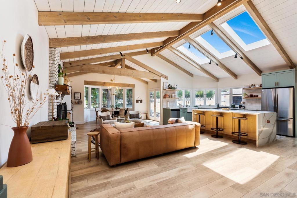 Discover this stunning, fully renovated designer ranch estate set on a spacious half-acre lot. This single-level home offers luxurious living with high-end finishes and abundant natural light throughout. It features two generously sized primary suites on opposite ends of the home, ideal for privacy or multi-generational living. The open layout is perfect for entertaining, with multiple gathering areas, a chef-inspired designer kitchen with skylights, and seamless indoor-outdoor flow. Step outside to enjoy your own private basketball court, a custom tool shed, and plenty of space to relax or expand. Additional highlights include a paid-off solar system, a finished and usable basement, a new water heater, and a whole-home water filtration system. This one-of-a-kind property blends comfort, style, and functionality—ready for you to move in and make it your own. Don’t miss this rare opportunity!