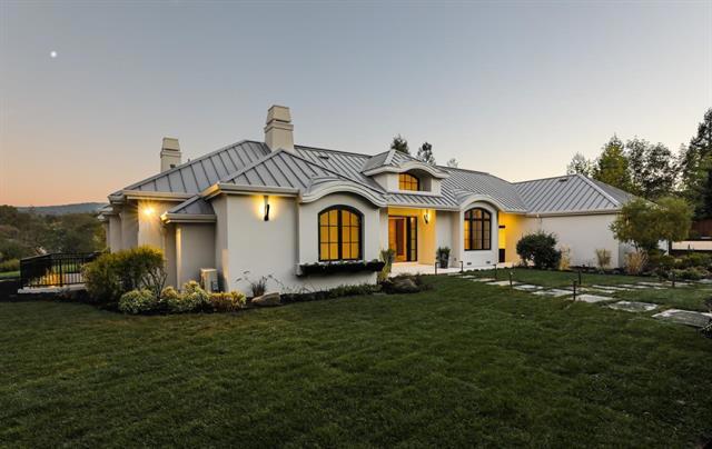 Private, quiet and gorgeous, Sunrise Farm Estate is a contemporary masterpiece - it is irreplaceable! Enjoy views of Western Hills + SF Bay and Silicon Valley. This contemporary property provides a modern, open floor plan as every room enjoys natural light along with an indoor/outdoor luxury lifestyle. The grand entrance opens to expansive open spaces. Inside are beautiful hardwood floors with radiant heat. Chef's kitchen boasts custom cabinetry, stone counters & professional stainless appliances. High ceilings extend throughout w/ tall windows to enjoy the views. Executive office + 6 bedrooms with expansive master suite & guest suite/au pair suite with private sitting room. Theatre room + gym/wine cellar. Very private & fenced yard is perfect to entertain & enjoy views to SF Bay and Silicon Valley. Stunning park-like grounds include outdoor kitchen, fireplace along with expansive flat areas, infinity edge pool and spa. 10.5kW solar array. Cul-de-sac location. Close to Stanford.