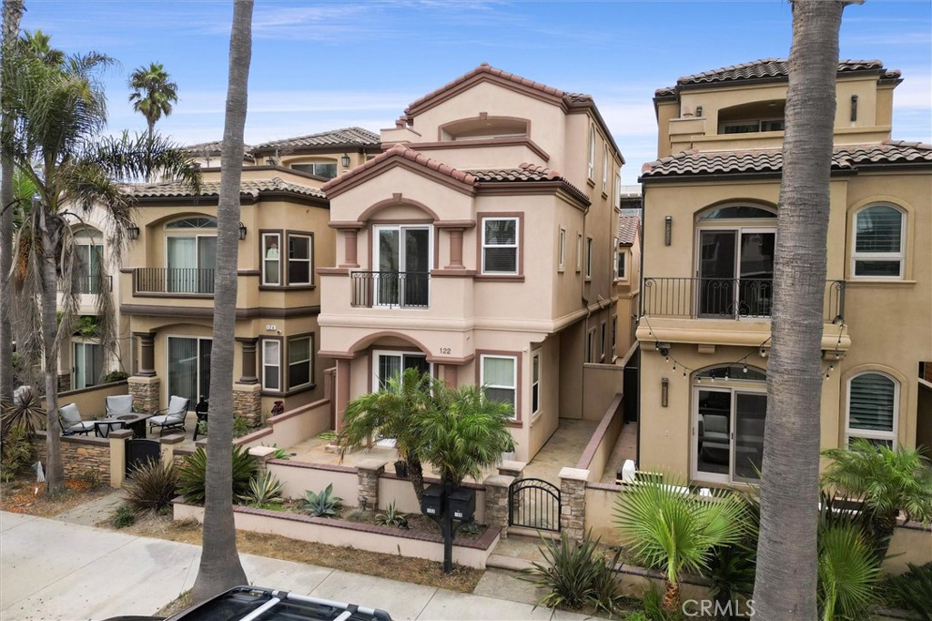 Live the ultimate Huntington Beach dream at 122 9th Street — a stunning single-family home just steps from the sand, perfectly positioned directly across from the ocean with sweeping coastal views from multiple levels. From morning surf checks to sunset cocktails on the rooftop balcony, this home delivers the best of SoCal beachside living. Step inside and feel instantly at home. The main floor features a bright, open-concept living room with a cozy fireplace, formal dining area, and a sunlit kitchen with an eat-in nook. A separate laundry room and direct garage access keep life convenient and sand-free. Upstairs, you’ll find three spacious bedrooms plus a loft with its own fireplace — ideal for a lounge, office, or media room. The primary suite is pure coastal comfort with its own fireplace, spa-inspired bathroom with soaking tub and walk-in shower, and a generous walk-in closet and of course, ocean views. The third floor is a bonus haven, complete with a full bath and access to the private rooftop balcony, where ocean views and sea breezes steal the show. Use it as a game room, lounge or 4th bedroom. Located in the heart of Downtown Huntington Beach, you’re just moments from Main Street, Pacific City, and the iconic HB Pier — where dining, boutique shopping, and nightlife come alive. Love the outdoors? You’re also walking distance to Dog Beach, the Bolsa Chica Wetlands, the scenic walking and biking paths that stretch for miles along the coast. All of this in the award-winning Huntington Beach City School District — because luxury living and lifestyle shouldn’t come at the cost of convenience. This isn’t just a home — it’s a front-row seat to the Huntington Beach lifestyle you’ve always dreamed of.