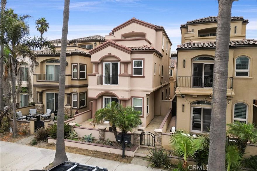 Live the ultimate Huntington Beach dream at 122 9th Street — a stunning single-family home just steps from the sand, perfectly positioned directly across from the ocean with sweeping coastal views from multiple levels. From morning surf checks to sunset cocktails on the rooftop balcony, this home delivers the best of SoCal beachside living.  Step inside and feel instantly at home. The main floor features a bright, open-concept living room with a cozy fireplace, formal dining area, and a sunlit kitchen with an eat-in nook. A separate laundry room and direct garage access keep life convenient and sand-free.  Upstairs, you’ll find three spacious bedrooms plus a loft with its own fireplace — ideal for a lounge, office, or media room. The primary suite is pure coastal comfort with its own fireplace, spa-inspired bathroom with soaking tub and walk-in shower, and a generous walk-in closet and of course, ocean views.  The third floor is a bonus haven, complete with a full bath and access to the private rooftop balcony, where ocean views and sea breezes steal the show.  Use it as a game room, lounge or 4th bedroom.  Located in the heart of Downtown Huntington Beach, you’re just moments from Main Street, Pacific City, and the iconic HB Pier — where dining, boutique shopping, and nightlife come alive. Love the outdoors? You’re also walking distance to Dog Beach, the Bolsa Chica Wetlands, the scenic walking and biking paths that stretch for miles along the coast.  All of this in the award-winning Huntington Beach City School District — because luxury living and lifestyle shouldn’t come at the cost of convenience.  This isn’t just a home — it’s a front-row seat to the Huntington Beach lifestyle you’ve always dreamed of.
