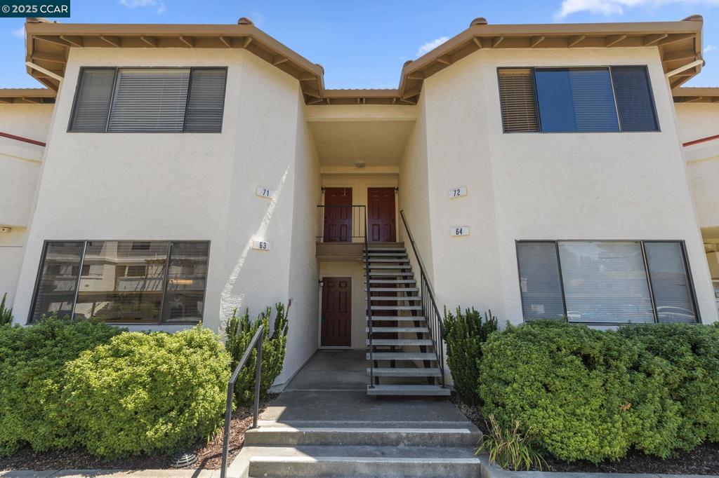 This is the one you've been waiting for! Nestled in the heart of Concord, this beautifully updated lower level residence offers a perfect blend of comfort, convenience, and modern living with no steps to entry. Situated in a conveniently located community, this property presents an ideal opportunity for families, professionals, or anyone seeking a cozy abode in a welcoming community. - Prime Location: Close to shopping, parks, and schools, near (but not right next to) the pool. Newer: Plank flooring, appliances, plumbing fixtures, switches/outlets/fixtures and window coverings, - Remodeled: Kitchen and bathrooms - Spacious Interior: Bright living space with lots of natural light. - Comfortable Bedrooms: 3 spacious, carpeted bedrooms with ample closet space. - Outdoor: Extended covered patio. Two assigned parking spaces, one is covered.