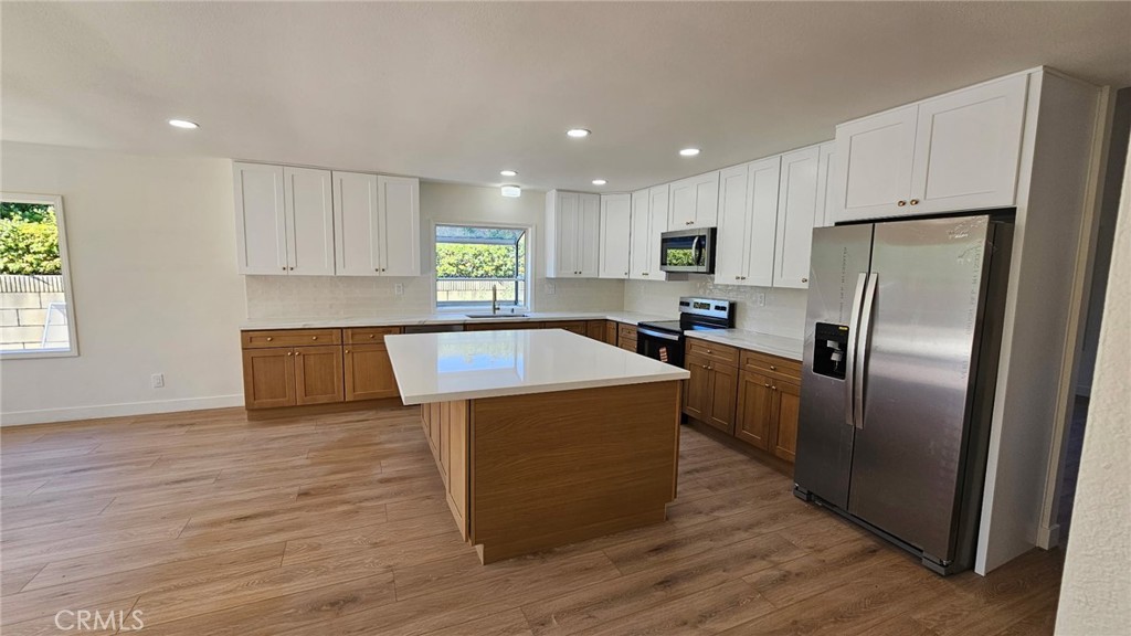 New Kitchen, new kitchen appliances, new flooring, new interior paint, new landscaping front and backyard, new bathroom vanities, newer AC installed. More photos coming soon.