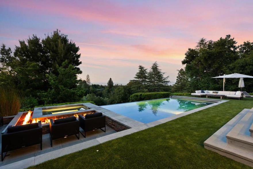 Nestled in the illustrious Los Altos Hills, this impeccable estate offers an unparalleled living experience. The luxurious oasis situated in one of the most coveted neighborhoods, boasts expansive grounds featuring a resort-style infinity edge pool & fire pit, meticulously manicured gardens, private guest cottage, plush lawn & sport field, bbq area with bocce, perfect for entertaining or relaxation. The residence itself, an architectural marvel, seamlessly blends modern luxury with timeless elegance. Large windows punctuate the home, flooding interiors with natural light & offering unrivaled vistas throughout. The state-of-the-art kitchen, exquisite living spaces, & opulent bedrooms ensure comfort and grandeur coexist; all while being minutes from vibrant downtown Los Altos with proximity to top-tier schools, shopping, & dining. The main house features 7 bedrooms & 5.5 half bathrooms with ~4,983 square feet of living space. A private 2 bedroom & 2 bathroom 914 square foot guest ideal for family and friends. Square footage breakdown is as follows: Main House 4,983, Guest House 914 and Garage is 529 sq.ft. with additional storage above. Total square footage is 6,426. The perfect fusion of prime location, mesmerizing views, & architectural splendor awaits its next discerning owner.