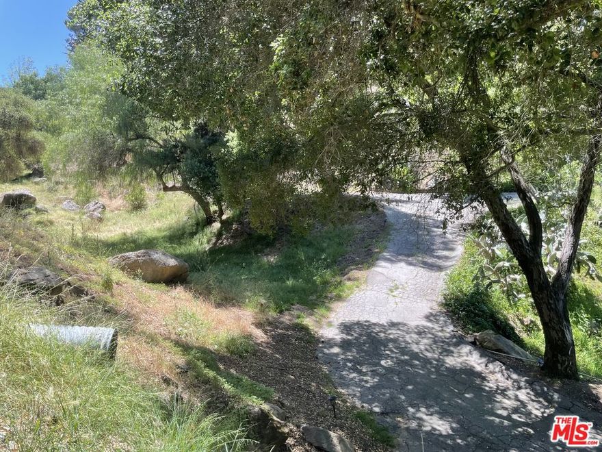 Discover the potential of this serene 1/2 acre parcel nestled beneath a canopy of beautiful, mature trees in the heart of enchanting Topanga Canyon. With meadow-like surroundings and mountain vibes, this is an ideal canvas for the buyer looking to design and build their dream home from the ground up. Located in a unique and eclectic community known for its creative spirit and natural beauty, this property offers both privacy and charm in an established neighborhood. The peaceful, wooded setting feels miles away from the city, yet you're just a short drive from the coast and all the amenities Malibu has to offer. Whether you're a first-time land buyer or an experienced builder, this is a standout opportunity. There is simply nothing else of this caliber at this price in the area. Easy to preview come walk the land and imagine the possibilities.