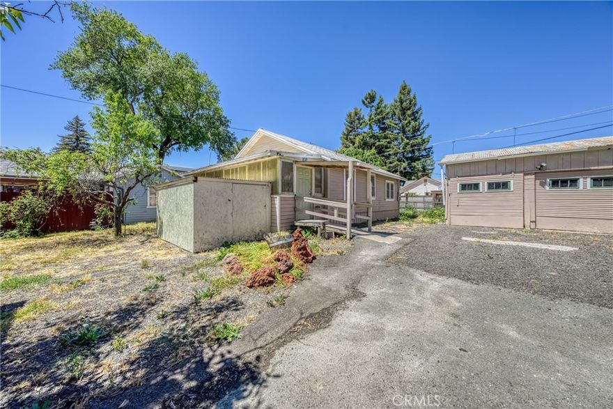 Own a piece of local Lucerne history. Built in 1935 one block from the lake, this 2 Bedroom, 1 Bath cottage has a newly updated Kitchen, renovated 4-piece Bath, and freshly painted Bedrooms with new hardwood laminate flooring. Separate 2-car garage with a raised floor, sink and washer/dryer hookup could be a workshop or additional storage.  House is set back on a good-sized lot to allow room for two walnut trees, a couple of rose bushes, and several peach trees. Relax in the evenings in the private Sunroom. Within walking distance to several amenities, including shopping, the elementary school, community garden, parks, boat launch and the lake.