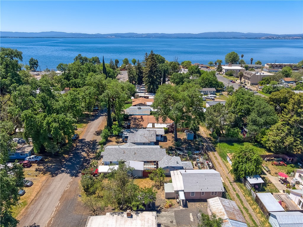 Own a piece of local Lucerne history. Built in 1935 one block from the lake, this 2 Bedroom, 1 Bath cottage has a newly updated Kitchen, renovated 4-piece Bath, and freshly painted Bedrooms with new hardwood laminate flooring. Separate 2-car garage with a raised floor, sink and washer/dryer hookup could be a workshop or additional storage. House is set back on a good-sized lot to allow room for two walnut trees, a couple of rose bushes, and several peach trees. Relax in the evenings in the private Sunroom. Within walking distance to several amenities, including shopping, the elementary school, community garden, parks, boat launch and the lake.