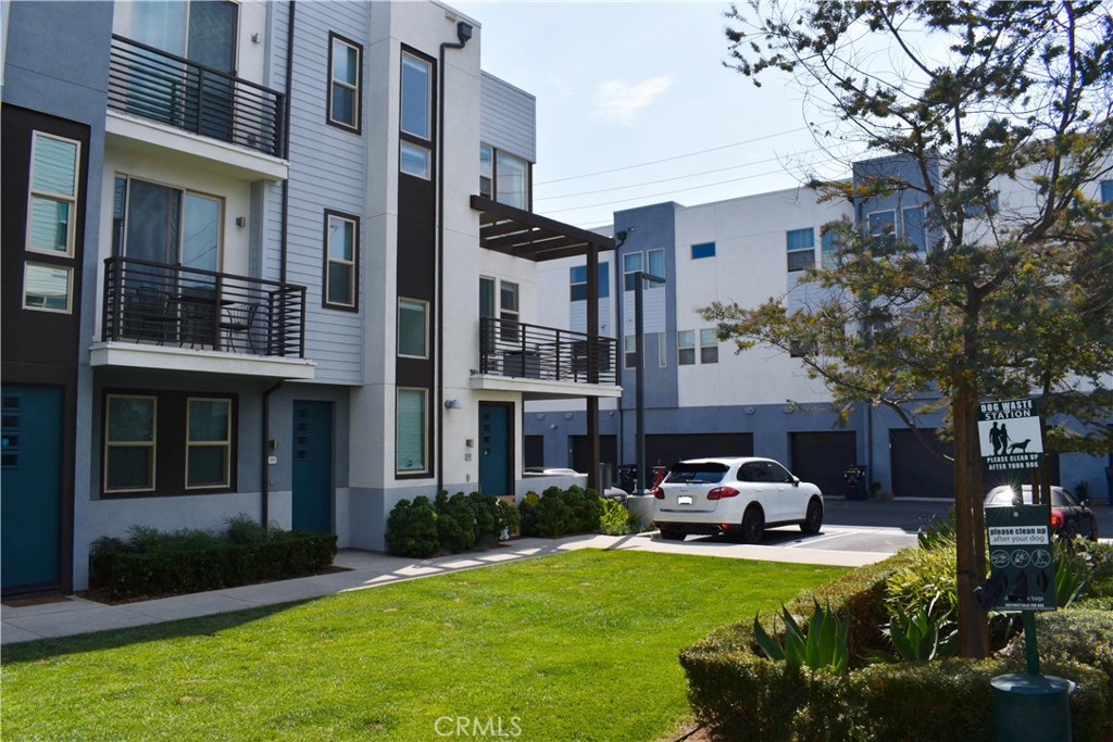 Welcome to 321 Placemark, a modern three-story townhome built in 2019, offering stylish design, functional living, and excellent value in a desirable Irvine location. The top floor features two full-sized bedrooms, each with its own en-suite bathroom—the primary includes a walk-in closet, while the second offers a private setup ideal for guests or family. A laundry closet on this level fits a side-by-side washer and dryer. The second floor showcases a bright, open-concept layout that connects the kitchen, dining, and living areas, complete with a convenient powder room for guests. Downstairs, the ground level includes a versatile den or office with its own half bath, perfect for working from home or creating a dedicated hobby space. The attached two-car garage offers additional room for storage. Residents enjoy access to a beautifully maintained community featuring a swimming pool, shaded BBQ and picnic area, cozy fire pit lounge, and an urban garden—ideal for relaxing, entertaining, or connecting with neighbors. With low taxes, no Mello Roos, and a low $342/month HOA, this home is just minutes from UCI, John Wayne Airport, major freeways, top shopping, dining, and Southern California’s iconic beaches.