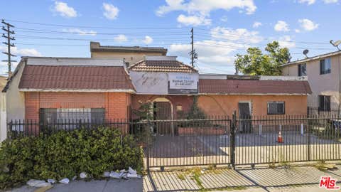 Photo of 9511 S San Pedro Street, Los Angeles, CA 90003 (MLS # 26865087)