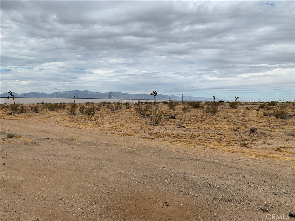 ±5.96 acres of unimproved commercial land for sale on Adelanto Rd in Adelanto, APNs: 3128-221-08, 09, 10. Zoned Mixed Use (MU) these lots allow for a blend of commercial and multifamily development, permitting 12-18 dwelling units per acre. Water, Sewer, Power, are at site with 665 ft of frontage on Adelanto Rd. Fantastic exposure to Highway 395 with approximately 22,000 ADTs with immediate proximity to the Adelanto Plaza & Event Center. The Event Center hosts outdoor concerts, festivals, car shows, and corporate events throughout the year. This site is also in proximity to support the expansion of the Southern California Logistics Airport (SCLA). Having undergone a major expansion of over 3MM sf, SCLA is home to such tenants as Amazon, Boeing, M&M/Mars, Keurig/Dr. Pepper, and Newell Rubbermaid. Buyer to verify all information contained herein. Agent and their representatives are not responsible for the accuracy of these claims. Broker of record also has a controlling interest in ownership entity of the property.
