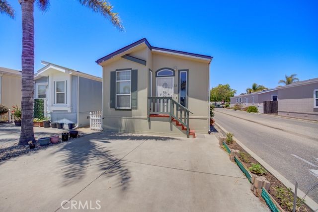 Charming Coastal Retreat. Move-In ready modular home that features 2 bedroom, 1 3/4 bath. Approximately a 15 minute drive to the ocean! This spacious property features an open floor plan, perfect for entertaining and a convenient in home laundry room. Nestled in a well maintained mobile home community you're just a short walk to restaurants, grocery stores and shopping. Whether you're looking for a permanent residence or a coastal getaway, this home offers the perfect blend of comfort, convenience, and location!
