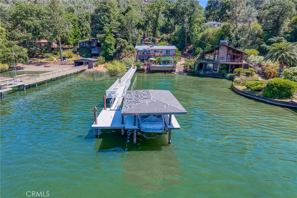 Gorgeous Lakefront Resort – A Hidden Gem in Kelseyville!
NO HOA | Private Dock | ADU | Income Potential
Welcome to your dream lakefront retreat! Nestled in the heart of desirable Kelseyville, this beautifully maintained waterfront property on Clear Lake is a rare find—with no HOA and endless possibilities. Whether you're looking for a full-time residence, vacation home, or income-producing short-term rental, this property truly has it all.
Step inside the 2,900 sq ft main home and enjoy peaceful, panoramic views of the lake from the bright and inviting living room. The well-appointed kitchen offers ample storage and is perfect for entertaining or enjoying quiet family meals. The dining area is perfect for that holiday dinner and there is an inside laundry.
Upstairs, you'll find two spacious bedrooms and two full baths, while the lower level features a complete in-law studio unit with its own kitchen, full bath, and private walk-out patio that leads directly to the pool and dock—ideal for guests or vacation renters.
The low-maintenance yard leads to your very own private waterfront oasis, and the oversized garage with dual doors is large enough to store a bass boat or other lake toys year-round. The shared boat launch and long driveway offer plenty of additional parking.
As an added bonus, the property includes a fully furnished ADU with its own septic, garden, porch, and parking area, complete with RV hookups—ideal for guests, extra income, or multigenerational living.
Located on California’s largest natural lake, Clear Lake is a haven for world-class bass fishing, boating, and outdoor recreation. All this just:
• 45 minutes to Napa Valley
• 2 hours to Sacramento
• 2.5 hours to San Francisco
Whether you’re lounging poolside, launching your kayak, or enjoying a sunset on the dock, this home offers the perfect mix of relaxation and adventure.
Don’t miss this rare opportunity to own a piece of paradise—schedule your private showing today!