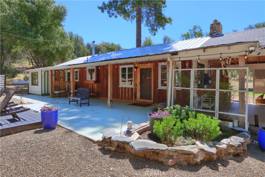 Welcome to Your Private Sierra Foothills Retreat—Just Minutes from Yosemite National Park!
This beautifully maintained 2-bedroom, 1-bathroom home sits on a gorgeous 21± acres in the heart of Mariposa County, offering both privacy and stunning views of Butterfly Creek Winery and the surrounding Sierra foothills. Located just a short drive from the southern entrance to Yosemite National Park and several recreational lakes—including Lake McClure, Bass Lake, and Lake Don Pedro—this property is the perfect basecamp for summer boating, fishing, and year-round outdoor adventure.
The home offers a warm and inviting 1,126 sq. ft. of updated living space with granite countertops, tiled floors, and a well-appointed galley kitchen complete with stainless steel appliances and ample cabinetry—perfect for home chefs and entertaining. Large original bay windows in the living and dining area flood the space with natural light and provide peaceful views of the surrounding wildlife and open land.
Each bedroom features mini-split systems for heating and cooling, along with new windows, and can be sold furnished, making it an ideal turnkey vacation rental or full-time residence. A dedicated office/laundry area adds convenience for those who work remotely.
Outside, the land is fenced & gated and opens up to the lush green grass meadow where you will enjoy a variety of wildlife from deer, birds, turkeys, and so much more while ensuring plenty of privacy. The property includes a two-car carport, rolling workbenches, an exterior-mounted TV, and abundant usable land with potential for gardening, livestock, or additional development. The parcel may be splitable, offering opportunity for future expansion. Two 2,500-gallon water storage tanks and a working spring box support your vision—whether it’s creating a lush garden or developing a second homesite.
Enjoy peaceful living just 15 minutes from historic downtown Mariposa, while still feeling completely tucked away in nature. Whether you're watching deer roam the property, exploring nearby trails, or planning your next Yosemite hike, this unique offering blends comfort, functionality, and breathtaking scenery.
Schedule your private showing today and experience the best of Sierra foothill living!