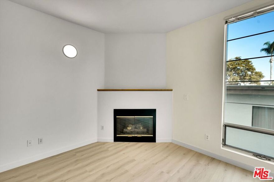 Modern Townhouse-Style Home for Lease in West Los Angeles. This stylish townhouse-style residence offers approximately 1,100 square feet of thoughtfully designed living space with a modern aesthetic throughout. Recently updated with brand-new stainless steel appliances, the home delivers both form and function across multiple levels. The open living area is bright and inviting, ideal for everyday living and entertaining. Upstairs, the primary bedroom retreat features a private balcony, providing a quiet outdoor escape. A standout feature is the private two-car garage with side-by-side parking, complete with a dedicated EV charger  a rare and valuable convenience. Well-located in West Los Angeles near dining, shopping, and major commuter routes, this home offers the ease of townhouse living with the privacy and amenities today's renters expect. Available now.