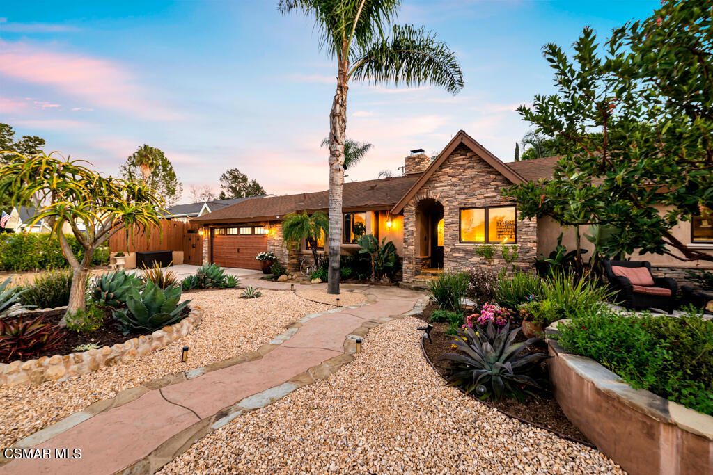 A Private Oasis in Waverly Heights - Where Every Day Feels Like a Vacation! Escape to your own private paradise with this stunning 4-bedroom, 3-bathroom, single-story residence, offering 1,833 square feet of living space on an expansive 13,000-square-foot lot. Designed for both relaxation and entertainment, this property is more than just a home--it's a lifestyle. Step inside to find a bright and inviting space filled with warmth and character. The main living areas feature beautiful wood flooring, adding to the timeless appeal of this home. The gourmet kitchen is a chef's dream, boasting granite tile countertops, a decorative tile backsplash, an island, a Dacor(r) 6-burner range with double-oven, a built-in Thermador(r) refrigerator, and a built-in Bosch(r) coffee/espresso machine. The living room exudes charm, featuring exposed ceiling beams, French doors, and a stacked stone fireplace that creates a cozy and inviting atmosphere. The spacious owner's suite is a retreat of its own, with French doors leading to the backyard, dual walk-in closets, and an abundance of natural light. A private back bedroom with an en-suite bath and direct backyard access makes for the perfect guest suite, while two additional secondary bedrooms enjoy a stylishly designed hall bath. The real magic happens outside. This backyard paradise is nothing short of breathtaking, designed to make every day feel like a getaway. Fire up the built-in BBQ under the tiki umbrella, grab a cold drink from the mini fridge, and enjoy an afternoon of fun in the resort-style pool with a slide and spa, surrounded by lush tropical landscaping. Whether you're shooting hoops on the basketball court or relaxing in the elevated gazebo--perfect for a quiet coffee break or an afternoon nap--you'll never want to leave. The entire property is thoughtfully designed with meandering steps and landscaped with drought-tolerant plants, offering beauty with minimal upkeep. For added versatility, the two-car garage has been converted into additional living space, complete with built-in shelving, custom tool cabinets, a stackable washer and dryer, a new sliding door, and durable garage tiles that can still be driven on. Prefer to use it as a garage? No problem--the garage door remains fully functional, giving you the best of both worlds. Additional storage is no issue, thanks to the newly added second attic space. Located in the sought-after Waverly Heights community, this home isn't just a place to live--it's a place to love. Welcome home to a life where every day feels like a vacation. Don't miss your chance to own this incredible retreat!