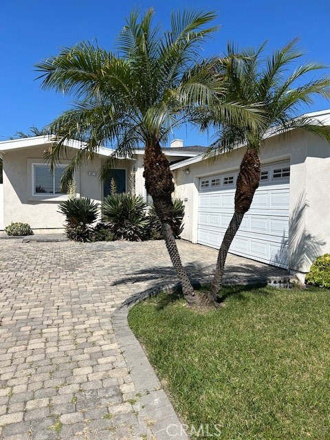MOVE-IN READY... 16621 Cerise Ave in North Torrance! This charming single-family home offers 3 bedrooms and 2 bathrooms across 1,484 square feet, nestled on a beautiful 5,232 square foot tree lined lot. Enjoy the bright, open floor plan, complemented by skylights and vinyl plank floors. The heart of this home is its bright updated kitchen featuring custom tiled countertops and backsplash, walls of spacious maple cabinets with brushed nickel pulls. Modern appliances include large fridge, microwave, dishwasher & oven, and of course the gas range makes cooking a joy. The living room welcomes you with arches, recessed lighting, prominent fireplace and lots of wall space. Additional highlights include a remodeled full hallway bathroom with designer tiles. The bathroom servicing the main bedroom is "simply amazing". Designed with ample closet & drawer space, the merging of mirrors and colors is nothing but luxurious, drawing you into the dramatic walk-in shower with built-in bench. Newer washer/dryer are conveniently located in the spacious two car garage with direct access to the house. Step outside to a fabulous backyard, ideal for entertaining under the shade of mature trees. Only 450' to Carr Elementary, close to Casimir Middle and North High. Walk to Alondra Park. Close to local shopping and restaurants. Easy access to I-405, 110 and 105, LAX and South Bay Beaches. Don’t miss this opportunity!