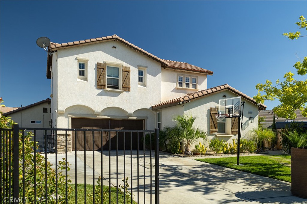 Welcome Home! Step into this stunning, model-like residence that exudes elegance and comfort from the moment you arrive. The heart of the home boasts a gorgeous open-concept kitchen with granite countertops, abundant cabinetry, and a seamless flow into the spacious living area—perfect for gatherings and entertaining. Downstairs, you'll find a large suite comparable in size to the master bedroom, complete with private access to a full bathroom. Upstairs offers three additional bedrooms, including a luxurious master retreat with a spa-like bathroom featuring dual sinks, ample storage, and a walk-in closet. The secondary bedrooms are connected by a spacious Jack-and-Jill bathroom, with a conveniently located laundry room just steps away. The Highlight? A thoughtfully designed ADU downstairs! Whether used for rental income, multi-generational living, or as a private master suite, it offers its own entrance for privacy while still connecting to the main home if desired. ADU is permitted. The backyard is a dream—large enough for RV parking, multiple vehicles, or even a future pool to create your own oasis. Currently, enjoy the stamped concrete patio, perfect for summer barbecues or relaxing evenings outdoors. The front of home is surrounded by lush palm trees that give the property a tropical touch. Located in a highly desirable part of Palmdale, close to everything you need, this home is truly a rare find. Whether you're looking for income potential or a comfortable space for two families, this property offers endless possibilities. Don't miss your chance to see this gem—schedule your showing today!