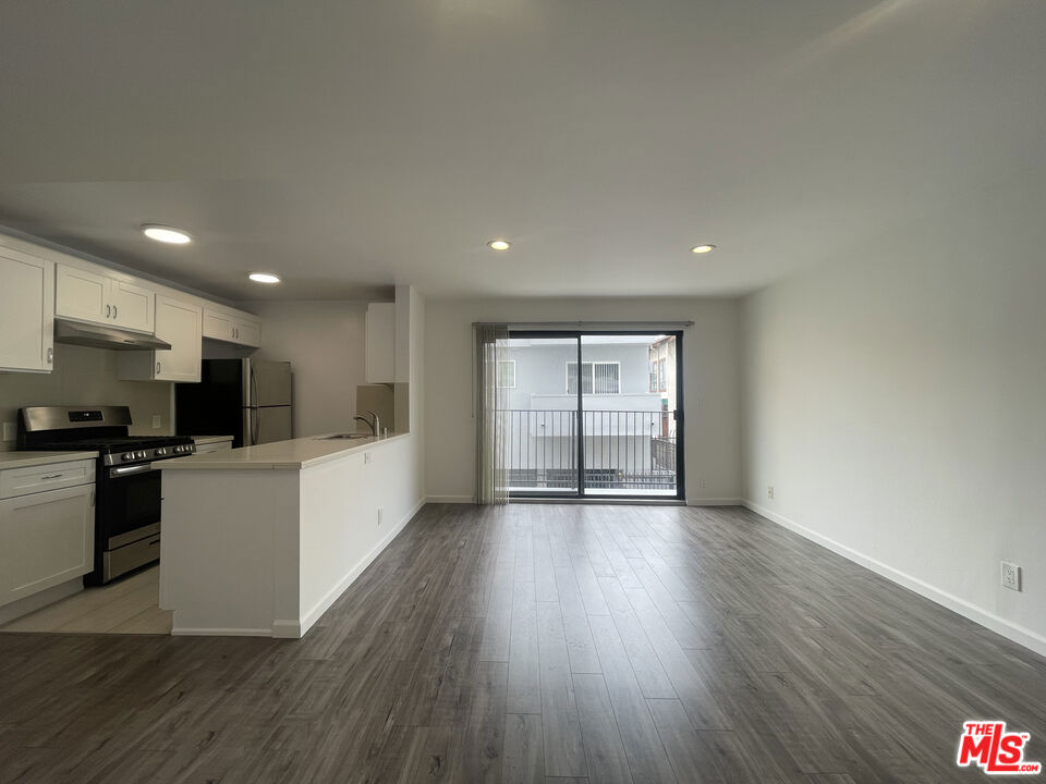 This spacious 1-bedroom, 1-bathroom apartment offers stylish, modern living in one of LA's most iconic neighborhoods. The unit features sleek stainless steel appliances, ideal for preparing gourmet meals in your contemporary kitchen. A convenient breakfast bar provides the perfect space for casual dining or entertaining guests.Enjoy the comfort of large closets that offer generous storage, and unwind on your private balcony, perfect for morning coffee or evening relaxation. Located in a controlled-access building with an on-site manager, this apartment also includes one dedicated parking space for your convenience.Live just moments from Hollywood's best shopping, dining, and entertainment. Don't miss the opportunity to make this your new home!