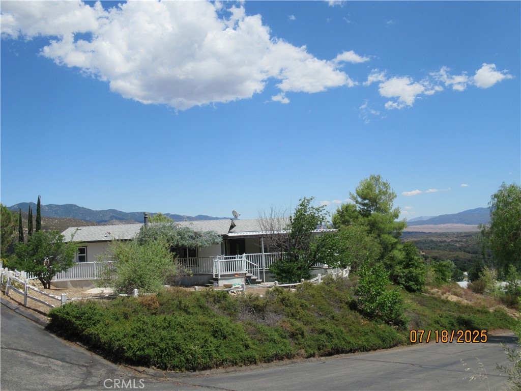 This charming property is located on a large corner lot in Warner Springs Estates, Stone Ridge, a 55+ community. Three bedrooms, two bathrooms, large living area with separate laundry room. The cozy kitchen is located off a private dining room which gives a hometown feel. There is also an additional attached room for storage or... and a detached shed. The mountain views offer the final touch that makes this house a home.
The community offers a large swimming pool, catch & release fishing lake and hiking trails. RV Storage is available. Stone Ridge is centrally located to Julian, Ramona, Borrego Springs. Only 35 minutes to Temecula for major shopping, medical offices, hospital, and restaurants. There are several local wineries nearby for your enjoyment along the North Mountain Wine Trail. You own the land.