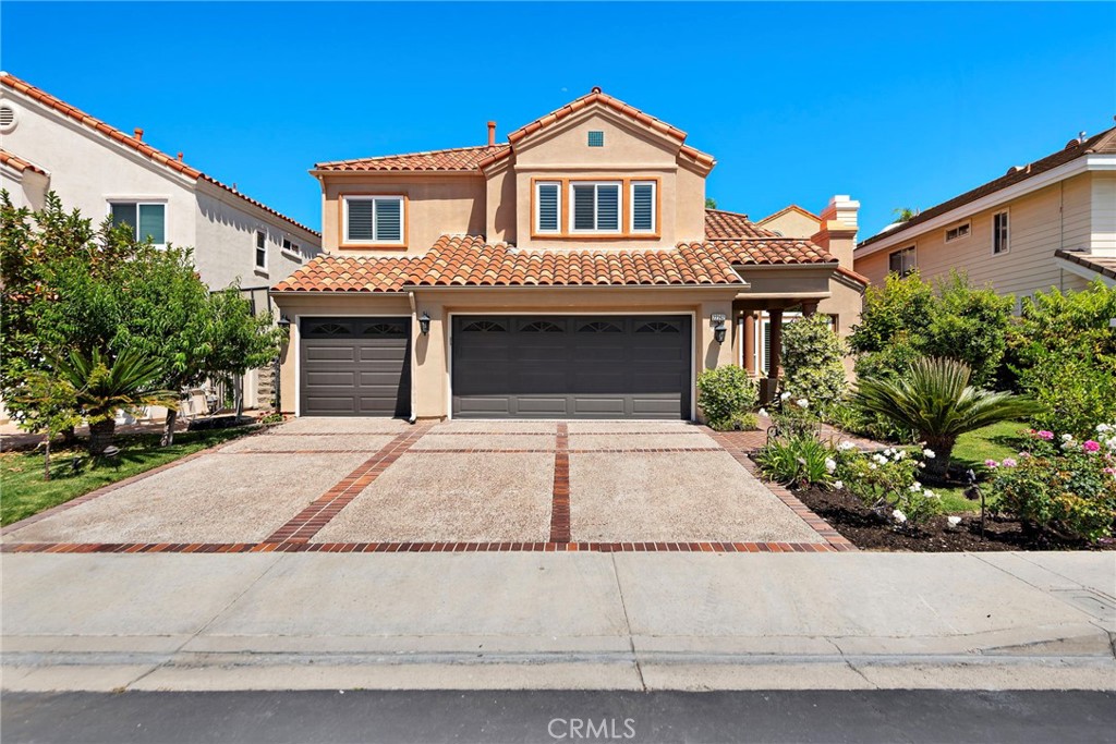 Seller Financing available (call for details)This highly upgraded home offers an open floorplan and amenities perfect for entertaining. As you enter the property through the wrought iron front door you are greeted by soaring ceilings and an elegant chandelier. High ceilings in the living room and dining area provide an open airy feeling and a main floor bedroom (currently converted to an office) as well as an upgraded main floor full-bath provide added comfort and functionality. The modern, upgraded kitchen is the focal point of the home. A quartz waterfall island and breakfast bar provide tons of space for dining and cooking. Lighting fixtures and backsplash provide sophistication and new appliances throughout the kitchen top it all off. A conveniently located pantry ensures that you will never run out of space. The kitchen seamlessly transitions to the family room, providing a perfect area to gather. Around the corner you will find a sleek wet bar equipped with a wine refrigerator. Upstairs, you will find the spacious primary suite with a long balcony to relax on. A fireplace, walk-in closet and updated primary bath provide a resort-like experience. Down the hall you will find two Jack and Jill bedrooms with an upgraded full bath shared between the two of them. At the end of the hall you will find the new en-suite bedroom, providing comfort and functionality. Downstairs, the home boasts a 3-car garage and a spacious laundry room with room for side by side Washer and Dryer, as well as tons of cabinets for storage. Outside you will find a hardscaped backyard with a built in barbecue island, fireplace and waterfall. The backyard and front yard are adorned with beautiful fruit trees producing a wide variety of fruits. The property underwent ADDITIONAL UPGRADES in 2023-2024 including brand new Milgard doors/windows, the home was repiped, new AC, new whole home water filtration system, new chandelier, new appliances and MUCH MORE! The 24 hour guard-gated community of Canyon Crest boasts endless amenities including 4 pools, spa, clubhouse, fitness center, tennis and racketball courts, playground, basketball court, BBQ area and much more! The home is located a short distance from Lake Mission Viejo, dining and other amenities.