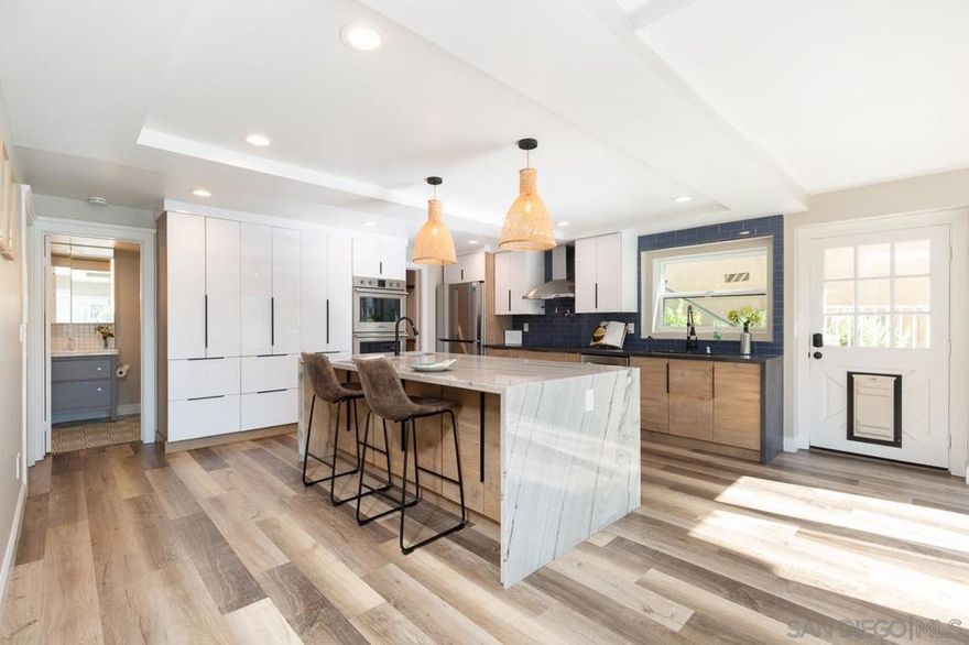 Step into a beautifully renovated home in the heart of University Heights where every upgrade has been thoughtfully designed. Fresh landscaping with new sod and river rock accents creates an inviting first impression. Inside, the layout flows easily with stylish finishes, updated bathrooms, and a warm contemporary feel throughout. The owners invested heavily in major improvements including leased solar, backup battery systems, an EV charger, mini split upstairs, tankless water heater, upgraded HVAC with new vents, radiant barrier and sealed attic, and sealed crawlspaces. This home runs efficiently, stays comfortable, and is built for long term peace of mind. Outdoor enhancements include gutters, turf and dog run areas, fruit trees, skirting around the deck, and space for gardening. The property feels clean, private, and ready for everyday living or entertaining. The location is exceptional. You are minutes from the beaches of La Jolla, SeaWorld, Downtown San Diego, the Gaslamp District, Little Italy, the airport, restaurants, grocery stores, parks, and hospitals. It is a rare blend of modern design, quality upgrades, and true central San Diego convenience. This is a move in ready home that offers comfort, efficiency, and style that is hard to find in this neighborhood.