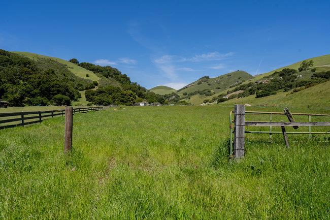 Where the Trail Ends, Your Dream Begins A once-in-a-lifetime opportunity to own 315 acres of iconic Central Coast landscape in San Benito County, just beyond the Monterey County line at the De Anza Trail gate. This legacy property offers unmatched versatility, privacy, and possibility. Rolling scenic meadows, heritage oaks, valleys, and mesas create the perfect canvas for a retreat, homestead, equestrian estate, or recreational getaway. Features include two rustic mobile homes, multiple natural springs, upgraded well, natural gas at the property line, and nearby electricity. The entire property is fenced, ideal for livestock. Enjoy direct De Anza Trail access, abundant wildlife, and end-of-the-road seclusion just minutes from town. Outstanding hiking, camping, and lifestyle potential.