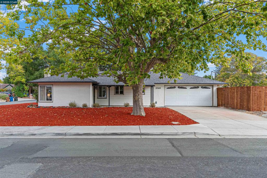 Welcome to 2049 Elinora Drive, a beautifully updated home in the heart of Pleasant Hill’s desirable Gregory Gardens neighborhood. This expanded 4-bedroom, 2-bathroom home offers approximately 1,455 sq ft of living space, thanks to a fully permitted addition that added two spacious bedrooms and a full bath. Inside, you’ll find a thoughtfully remodeled interior with a new roof and HVAC system. The light-filled living room features a cozy wood-burning fireplace and flows seamlessly to the dining area and updated kitchen. The kitchen showcases new cabinetry, quartz countertops, under-cabinet lighting, and modern appliances. New flooring throughout is complemented by recessed lighting, fresh paint inside and out, crown molding, and stylish fixtures. The finished garage with epoxy floors, built-in storage, and upgraded plumbing provides a versatile space for a home gym, workshop, or projects. Just minutes from downtown Pleasant Hill, local parks, trails, and shopping with easy access to BART and major freeways, this move-in ready home truly checks all the boxes for comfort and convenience.