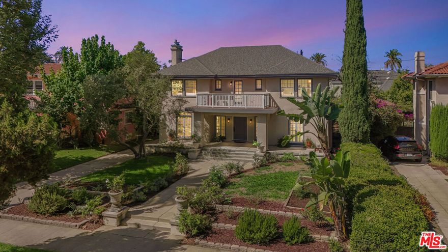 Welcome to this Contemporary Italian Mediterranean, perfectly located smack in the center of historic Lafayette Square. Filled with warmth, light, and character, this 6-bedroom, 4-bath offers the ideal blend of timeless Italian charm and comfortable American living.  A wide, covered front porch invites you in, leading to bright, airy rooms and lovely details. The spacious layout comprises a sunroom, a generous office, and two en-suite bedrooms, including a serene primary suite with its own fireplace perfect for cozy evenings at home. A large upstairs balcony overlooks the neighborhood, ideal for a relaxing drink and greeting friendly, passing neighbors. A 3rd floor loft/bedroom/rec. room gives the home the feel of a large, 3-story Italian estate, complete with huge closet/storage area.  Outside, discover a magical Tuscan / Mediterranean garden retreat bursting with life! Lemon, pomegranate, apple, apricot, blood orange, and fig trees are complimented by grapes, artichokes, rosemary, and cheerful morning glories. Dine under the grapevine-covered pergola, listen to the gentle fountain, or enjoy a friendly game on the Bocce Ball court. With a rare four-car garage and side garden this home offers both charm and practicality, an incredible place to grow up, retire or just live the LA lifestyle of indoor/outdoor entertainment with a dash of Italy!