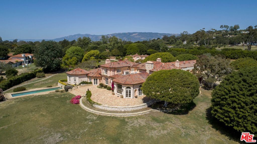 Reenvision this classic French Country Estate set in one of Santa Barbara's most private and extraordinary neighborhoods the historic Hope Ranch. Resting on a rare, vast 10 acres, this property boasts breathtaking flanking views of both the Pacific Ocean and the stunning Santa Ynez Mountain range. With a living space of over 13,000 sq ft, plus thousands of sq ft of patios, this home encompasses the ultimate in California living - plus two exquisite pools, extensive equestrian facilities, and a championship tennis court boasting the last of permitted night lighting, perfect for spontaneous midnight matches! Last but not least, this home is one of only 5 homes in Hope Ranch with direct access to the stunningly beautiful Hope Ranch Beach - one of the last private beaches in California, complete with cabanas, showers, equipment storage, and a seasonal lifeguard on duty. Other perks? This property is surrounded by miles of private trails exclusive to residents, be it for a trail ride equestrian style or a sunset run. Additionally, La Cumbre Country Club runs through much of Hope Ranch and provides a stellar private golfing experience complete with an excellent country club and dining facilities. Meanwhile, Laguna Blanca School offers a superb private K-12 education with a 35-acre campus in the heart of Hope Ranch. Take advantage of a compelling opportunity to create your own utterly private compound in one of the world's most beautiful areas, complete with incredible ocean and mountain views and the temperate weather Santa Barbara is renowned for the American Riviera at its absolute best. Bring your talented team and create the ultimate home and extraordinary lifestyle you've always dreamt of!