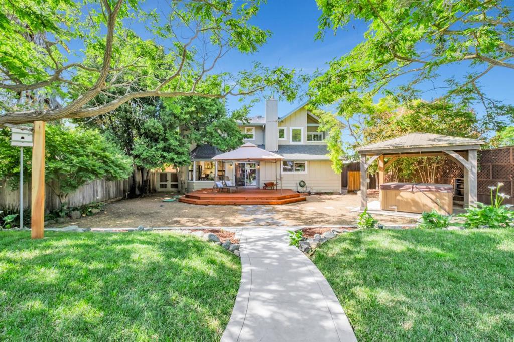 COUNTRY CHARM ON A QUIET STREET IN SUNNY CORRALITOS. Have you ever dreamed of stepping back in time to a slower pace, but without giving up any of the modern conveniences of life? This gorgeous turn-key Custom Craftsman Home has been lovingly restored, updated, and legally added onto with/ Custom Woodwork and solid oak floors. The bright, open kitchen is a dream, featuring granite counters, a custom wood island, and a farm sink, all ideally located right off the dining room, making it perfect for entertaining. The spacious primary bedroom suite has custom-built-ins and mountain views. A bonus feature is the attached mother-in-law unit. The expansive custom landscaped front and backyards feel like your own private park and Farmers Market right outside your door. The Travertine Patio and Spa with Fresh Rain, gazebo, garden area, chicken coop, and barn are rare additions to this custom craftsman home! Plus RV & Boat parking. In the Aptos School District, and 5 minutes to Monte Vista. This home is perfect for a family or a relaxing retirement sanctuary with enough room for the entire family to come for holidays, special occasions, and summer BBQs. Come see for yourself and experience what welcome home truly feels like.