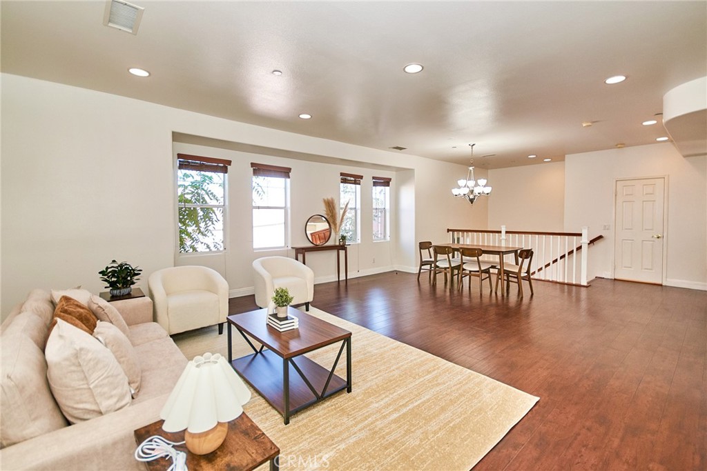 Location, location, location!! 717 Arcadia Ave #C is a sun-filled tri-level townhome tucked inside a gated community. Built in 2003, the 2,032 SF plan delivers 3 beds, 2.5 baths, a direct-access 2-car garage, interior laundry, and a bonus room perfect for an office, gym or playroom. The open main level boasts soaring ceilings, wood-look floors and a granite kitchen with cherry cabinets, stainless appliances and a walk-in pantry. A portion of the living room has been partitioned to create the bonus room (unpermitted). Easily reversible. A private, fenced patio just off the mid-landing extends your living space for coffee, pets or plants. Upstairs, the vaulted primary suite offers a walk-in closet, dual sinks, jetted tub and separate shower, while two secondary bedrooms share a full hall bath. Low HOA. Top-ranked Arcadia schools, Westfield Santa Anita, Park, fitness, supermarkets, shopping mall, and the 210 Fwy are all minutes away. Move-in Ready. Act fast—homes in this A+ spot rarely last!